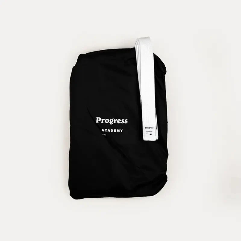 Kimono Brazilian Jiu Jitsu PROGRESS Copii Negru poza facuta cand kimonoul este aranjat in saculetul cu care vine acesta